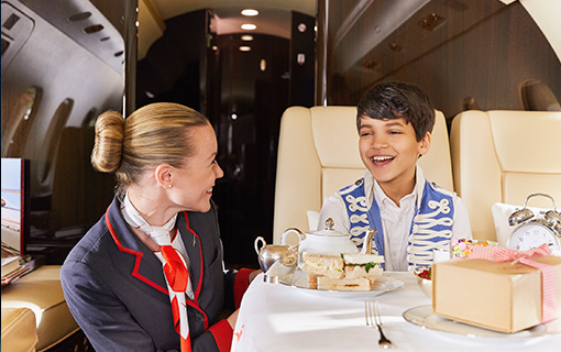 boy and airsteward on a plane