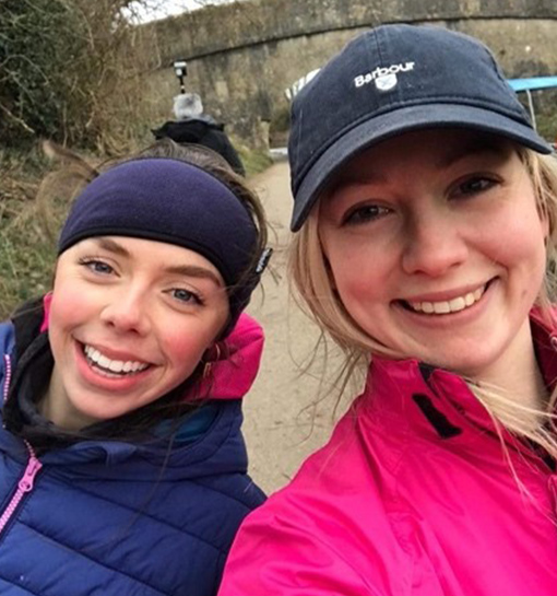 two female students in running attire