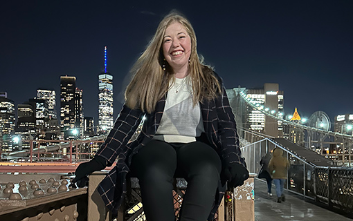 A female sat on a bridge in New York City