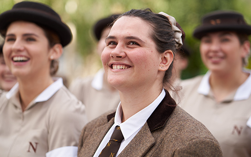 a female Norland Nanny in training smiling