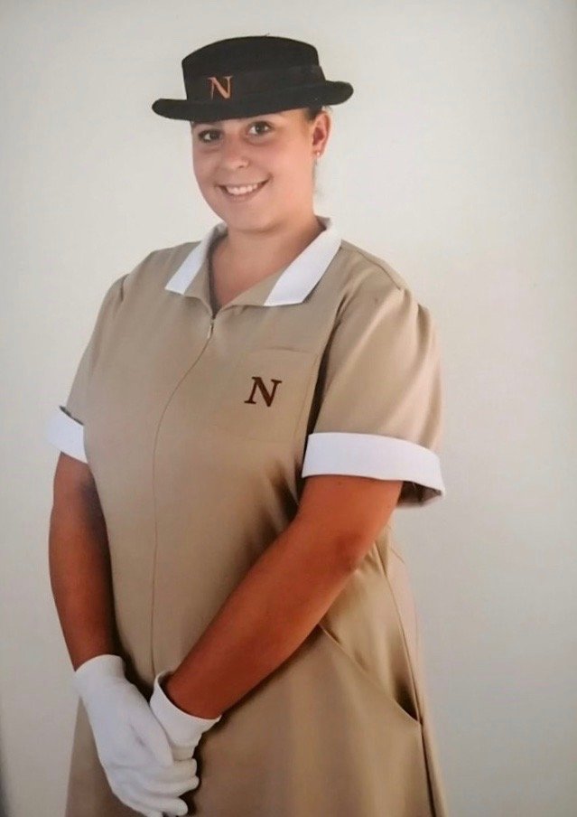 female headshot in Norland nanny uniform