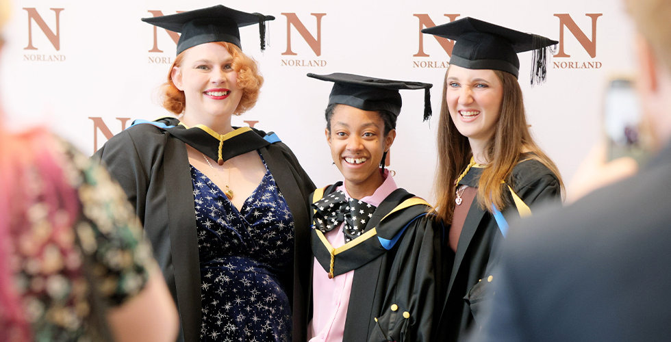 female graduates smiling