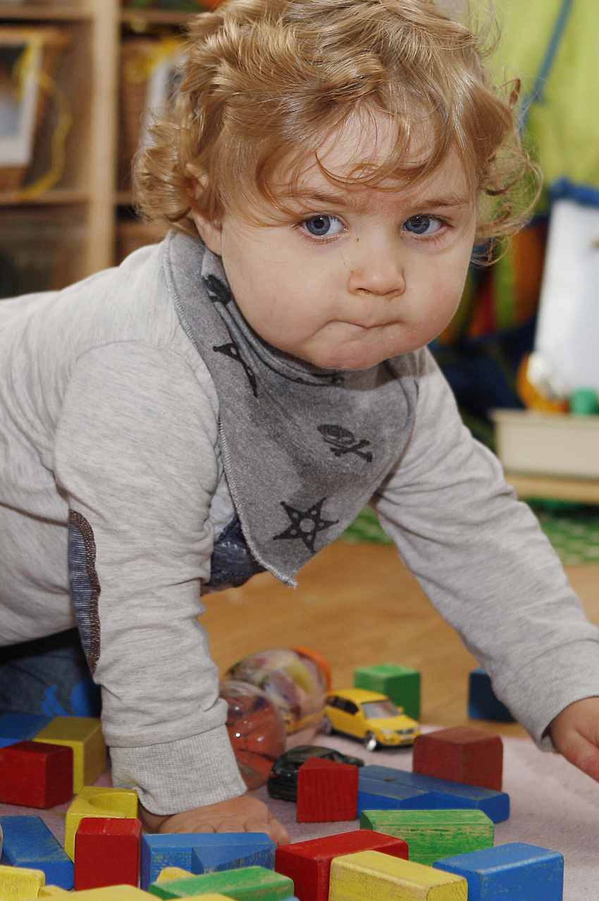 Child crawling in nursery setting