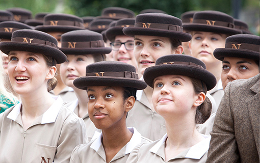 Norland students in formal uniform looking up